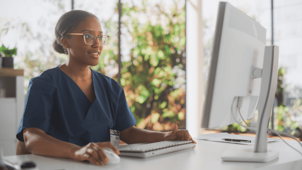 A healthcare professional working with a hospital information system