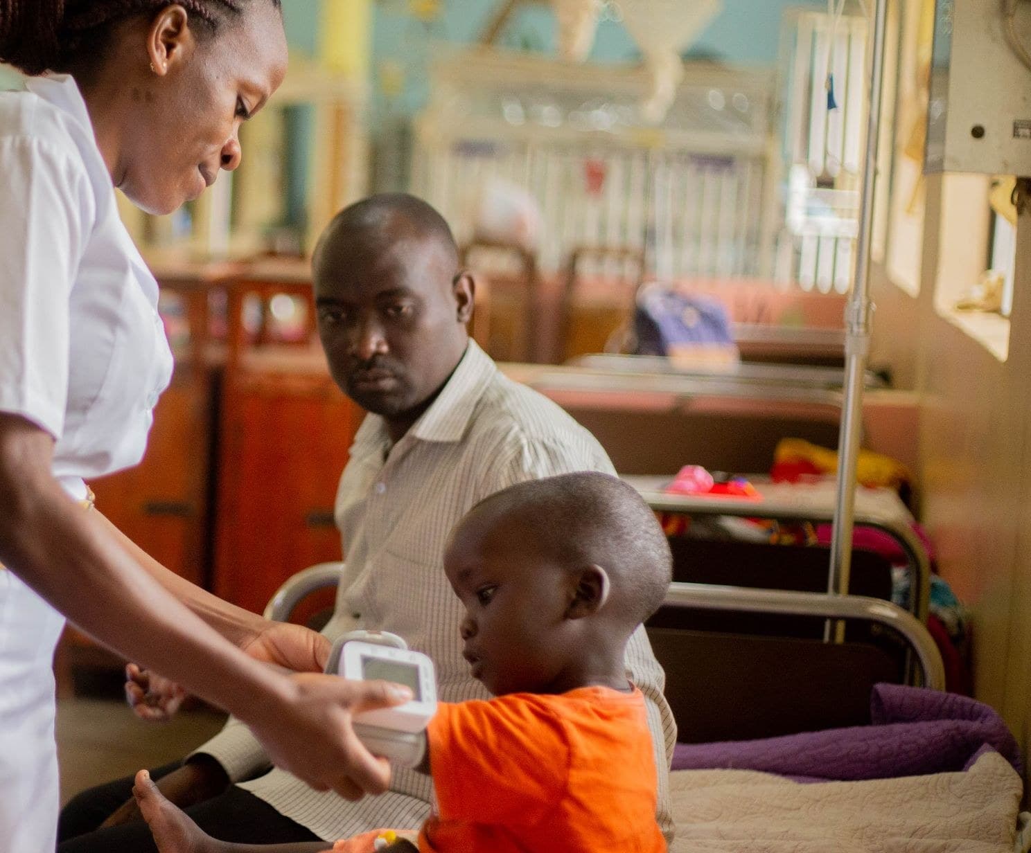 Nurse caring for a child at the bedside